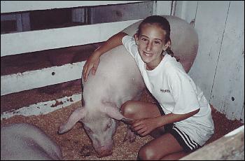 Picture of Andrea with pig.