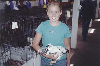 Picture of Megan with her chicken.